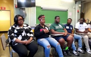 A college student gives advice on campus life at the alumni panel.